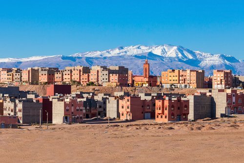 Ouarzazate city and High Atlas Mountains aerial panoramic view
